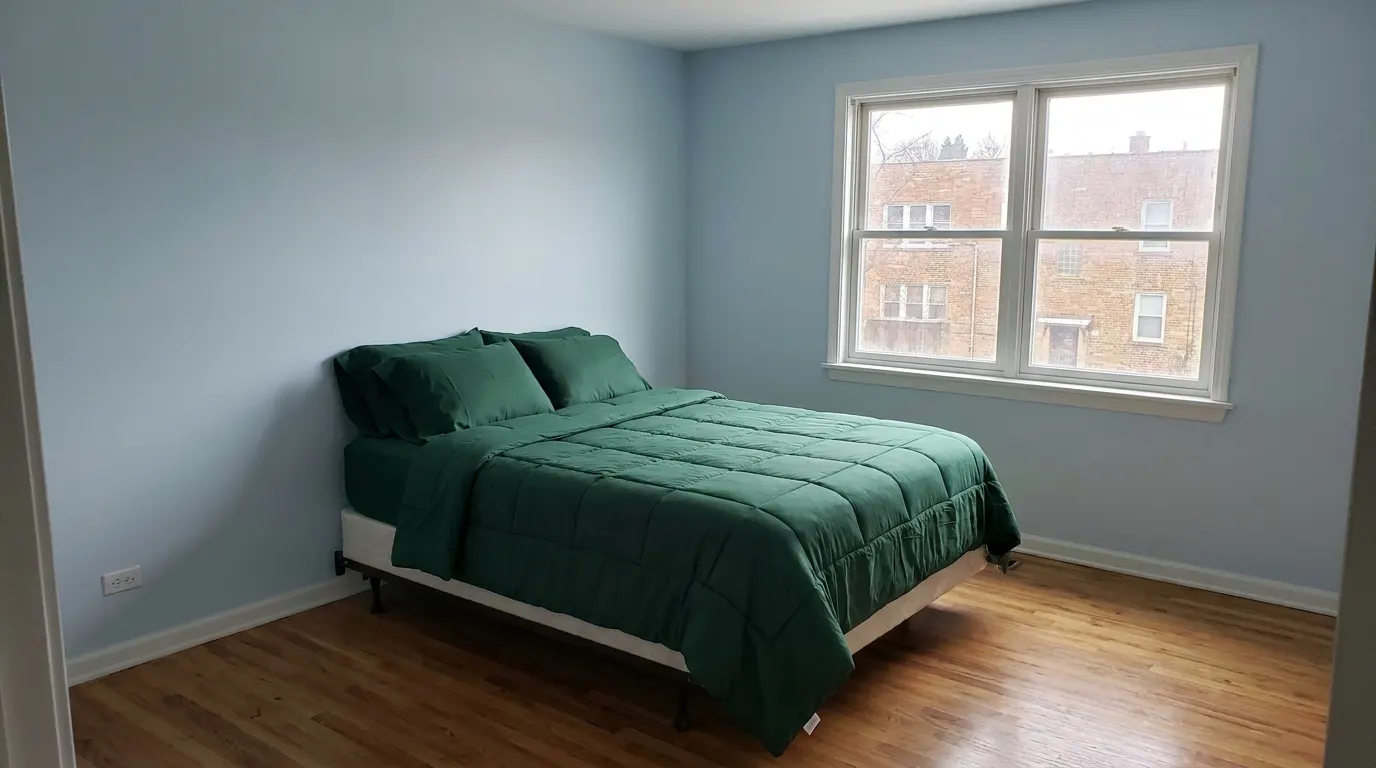 Same bedroom with rebuilt ceiling after storm damage restoration